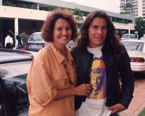 Woman and young man standing in a street