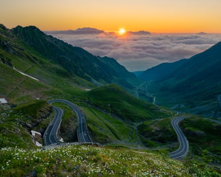 Switchbacks on a road in mountains soon after sunrise