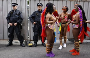 A group of performers in front of two police