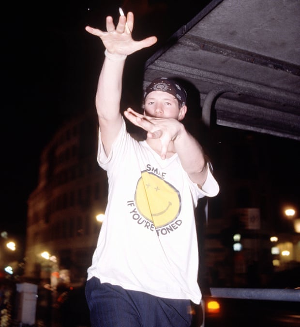 A raver in 1988 wearing a T-shirt with a smiley face on it.