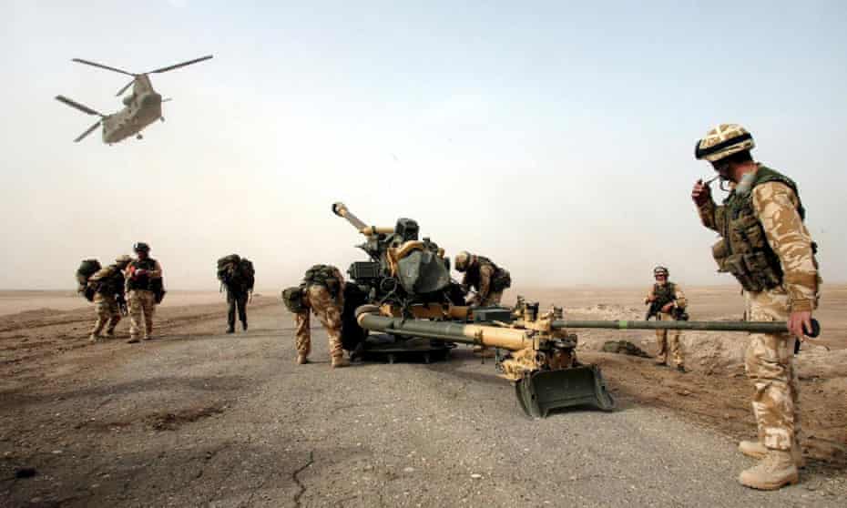 A 105mm gun is dropped by helicopter to British troops on the Fao peninsula in southern Iraq in March 2003.