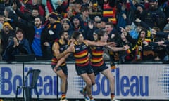 Ben Keays and the Crows celebrate the goal called a point in the round 23 loss to Sydney at Adelaide Oval.