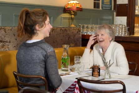 Ruth and Moira laughing at a restaurant table