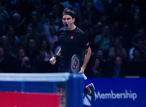 Roger Federer celebrates the win in his final Round Robin match against Novak Djokovic.