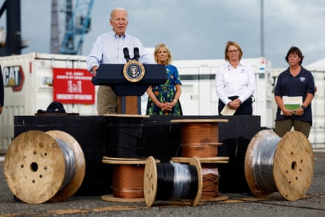 Joe Biden delivers remarks in Ponce, Puerto Rico, with first lady Jill Biden in the background on 3 October.