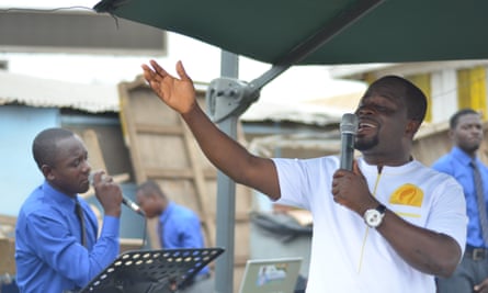 Apostle Michael Sarfo, who sets up at a busy intersection every weekday morning with other pastors and their loudspeakers to spread the gospel.