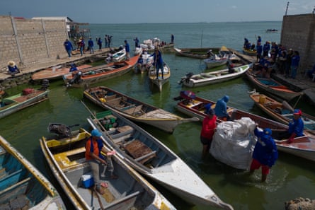 Fishers return to shore with all the plastic they have collected from the water.