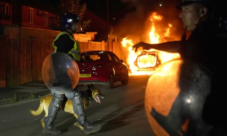 A police car burns during violent disorder in Hartlepool.