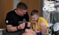 Archie Routledge and his dad Mark watch a film together whilst in GNCH
