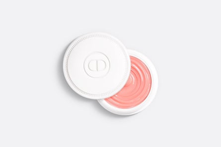 A white palette of pink Dior Crème Abricot strengthening nail care cream on a qhite background