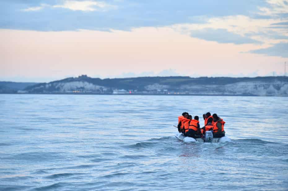 Migrants in a dinghy head towards the south coast of England last September after crossing from France.
