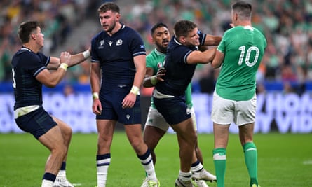 Scotland’s Ollie Smith clashes with Johnny Sexton