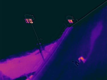 An athlete lands during the men’s snowboard ‘big air’ qualifiers at Livigno Snow Park.