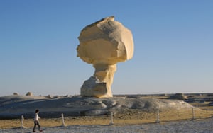 Tourists visit a large white inselberg known as the mushroom