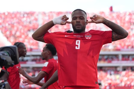 Cyle Larin celebrates scoring for Canada in their World Cup opener.