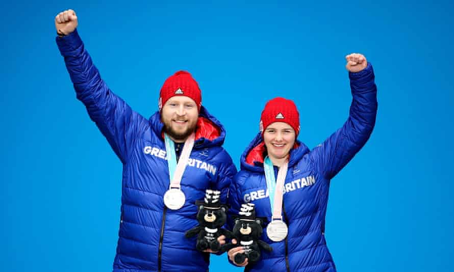 Silver medalists Millie Knight (right) and her guide, Brett Wild, on the podium at Pyeongchang in 2018
