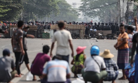 Myanmar riot police block a road in Yangon during a protest against the military coup