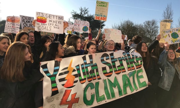 Protesters at a Youth Strike 4 Climate demonstration outside Shire Hall in Cambridge