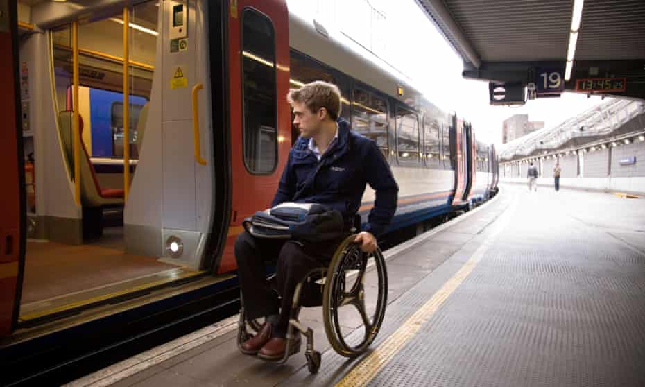 Disabled passenger at railway station in London