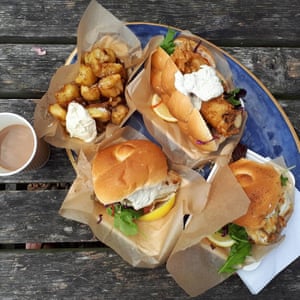 Food photo of seafood rolls and potato wedges from Dungeness Snack Shack.