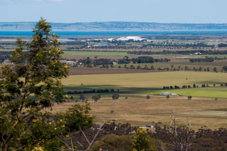 An expanse of land before a blue bay in Victoria.