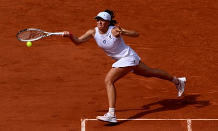 Iga Swiatek plays a forehand on her way to winning the French Open final against Karolina Muchova.