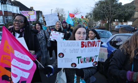 Striking teachers of Bishop Thomas Grant school in Streatham march out of the school gates on their way to a rally in central London.