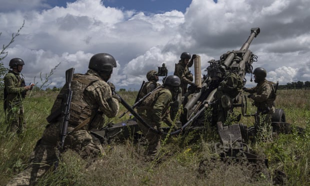 Ukrainian soldiers prepare to fire at Russian positions from a US-supplied M777 howitzer in Kharkiv last June.