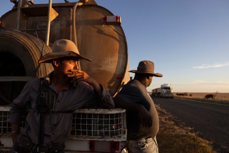 Swanson (L) and Chico Shaw at the end of the day watching the sunset over the Roma Southern Road.