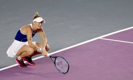 Marketa Vondrousova, pictured crouching on a tennis court during  a match at the WTA Finals in Cancun