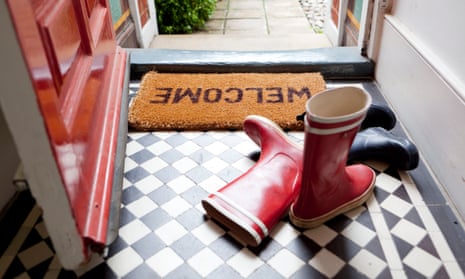 Wellington boots near a 'welcome' doormat