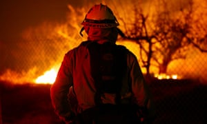 A firefighter keeps his eye on the Lilac fire in Bonsall, California.