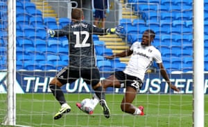 Josh Onomah’s shot is well saved by Alex Smithies of Cardiff City.