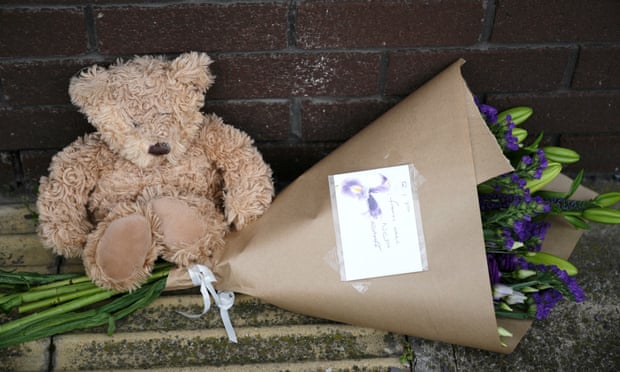 A toy bear and flowers left outside the OYO Metropolitan Hotel in Sheffield where a five-year-old Afghan boy fell to his death.