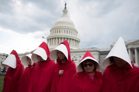 Supporters of Planned Parenthood dressed as characters from The Handmaid’s Tale, rally outside the US Capitol in Washington DC in June.