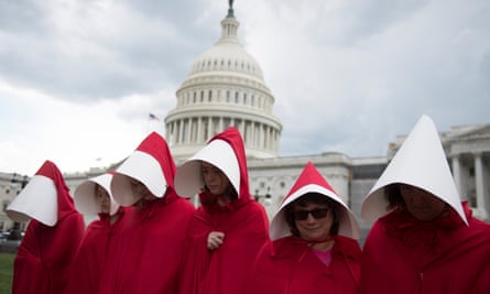 Protesters wear costumes inspired by The Handmaid’s Tale at a rally in Washington DC in June 2017.
