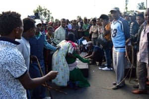Protesters surround a makeshift coffin in the town of Wolenkomi in Ethiopia’s Oromia region