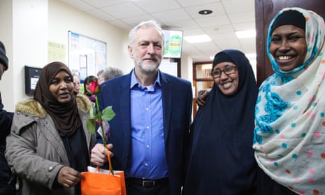 The Labour leader, Jeremy Corbyn, poses with women members of Finsbury Park mosque during its open day.