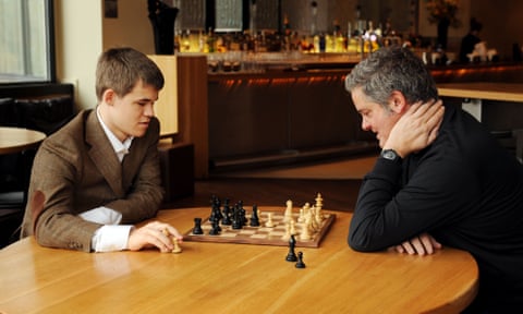 Stephen Moss playing chess with champion Magnus Carlsen.