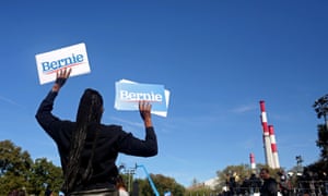 A supporter waves Bernie Sanders signs during the ‘Bernie’s Back’ rally in Queens, New York, on 19 October 2019.
