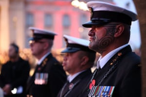Military personnel wearing their medals attend the Anzac Day dawn service at Auckland War Memorial Museum.