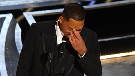 Will Smith apologises after hitting Chris Rock during Oscars ceremony – video