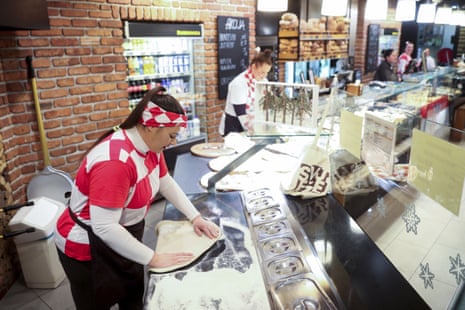 Bakery workers wearing Croatia football jerseys in Zagreb today.