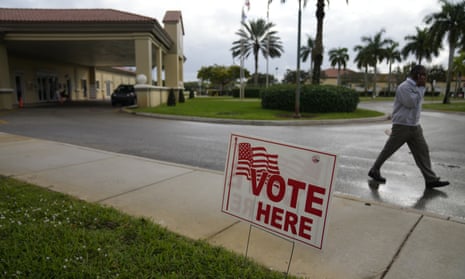 A man leaves a polling place at the Sunset Lakes Community Center as voting takes place in a special election for Florida's 20th congressional district seat, in Miramar, Florida on 11 January.