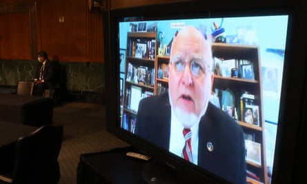 Robert Redfield, the CDC director, addresses a US Senate hearing on Covid-19 by video link from his home, where he is self-isolating.