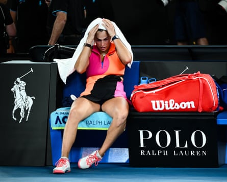 Aryna Sabalenka sits with towel over her head after losing the women’s singles final against Elena Rybakina