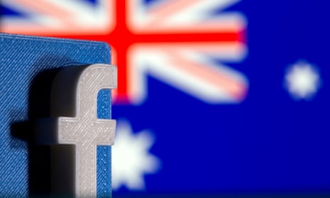 A 3D printed Facebook logo is seen in front of displayed Australian flag, photo taken February 18, 2021.