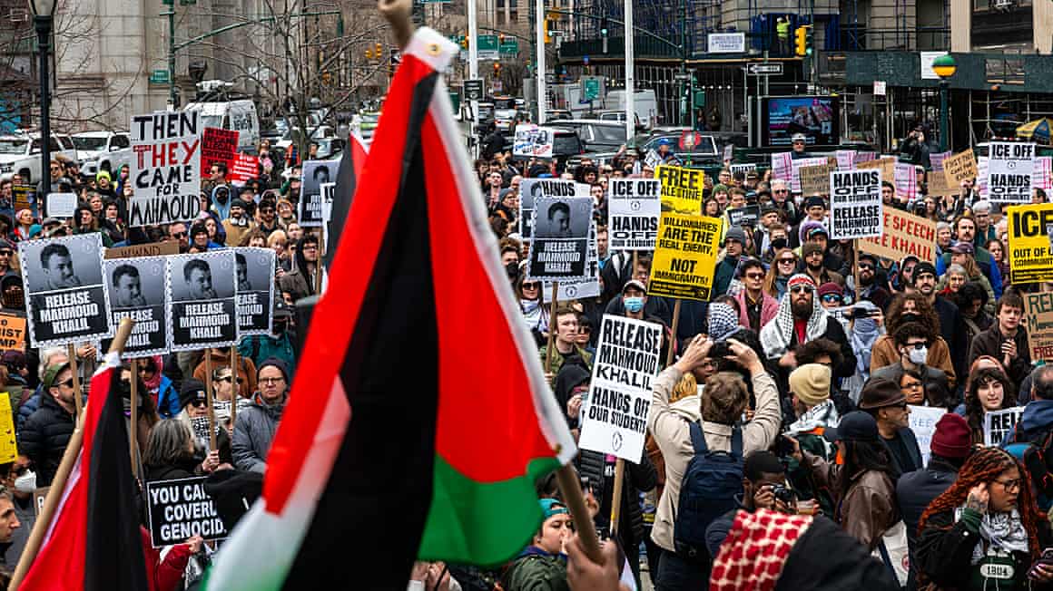 People carry banners and Palestine flags