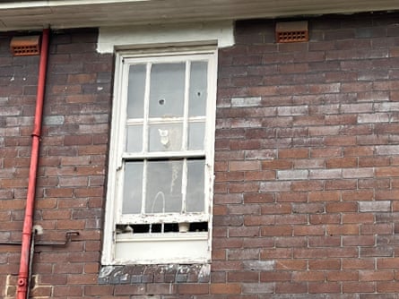 Apparent bullet holes in window along Georges River Road, Croydon Park.