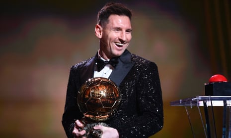 Lionel Messi clutches his prize after being awarded the  Ballon d'Or in Paris on Monday.